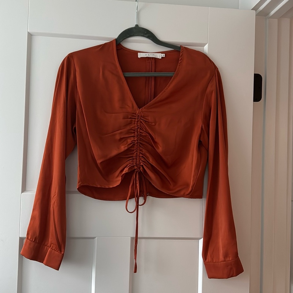 Burnt orange Satin cropped top with scrunch detail and zipper closer back.